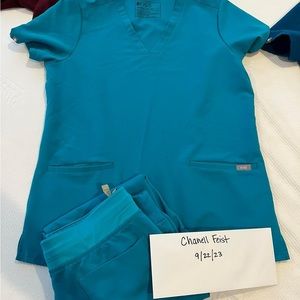 Teal small Zamora joggers and small Casma top.